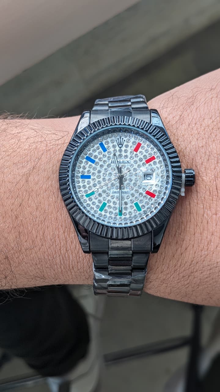 Rolex Datejust with a fluted bezel date window and fully diamond-style dial