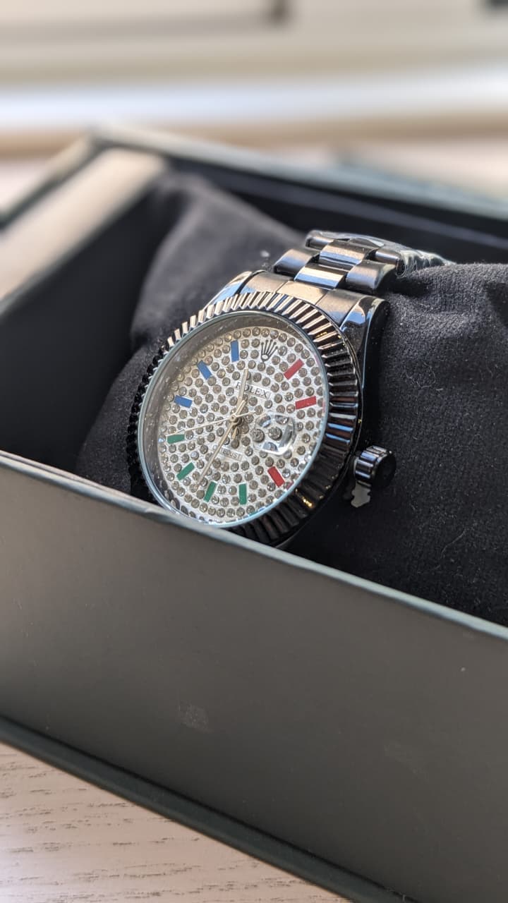 Rolex Datejust with a fluted bezel date window and fully diamond-style dial