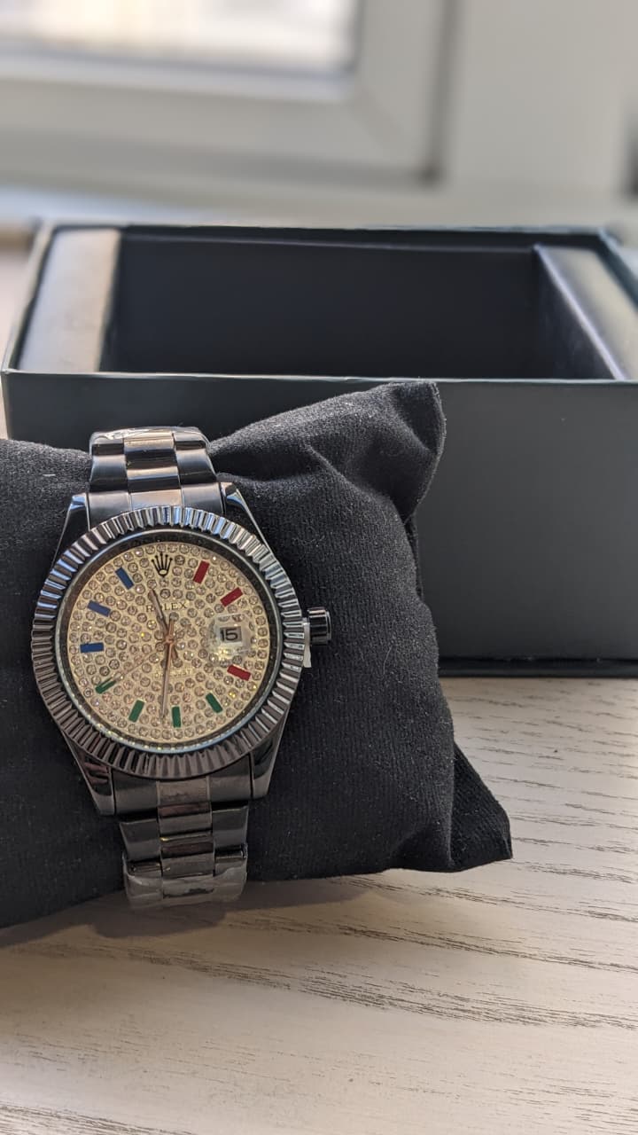 Rolex Datejust with a fluted bezel date window and fully diamond-style dial